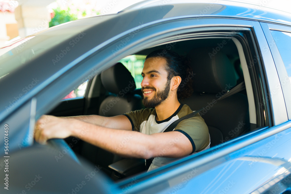 Happy man smiling traveling in the car