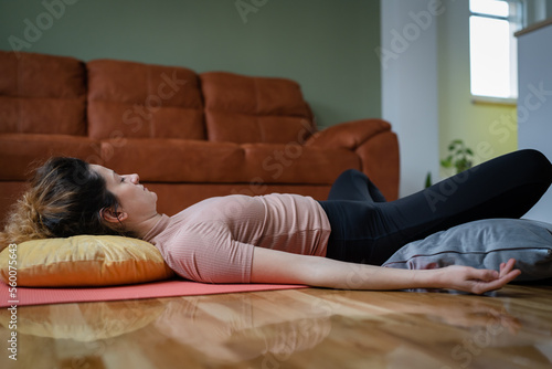 Картината върху платно One adult caucasian woman practice restorative yoga at home