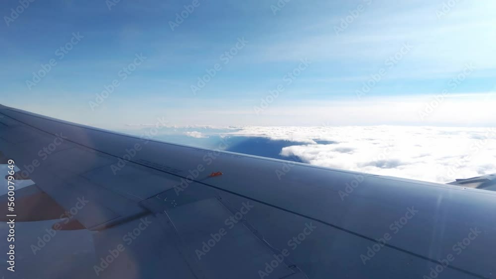 View from the window of the plane on the flight above the clouds View from the window of the plane on the flight above the clouds