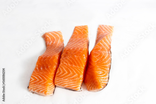 Fish, fresh salmon loins on white background in portrait