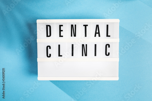 Dental Clinic sign on Blue Background photo