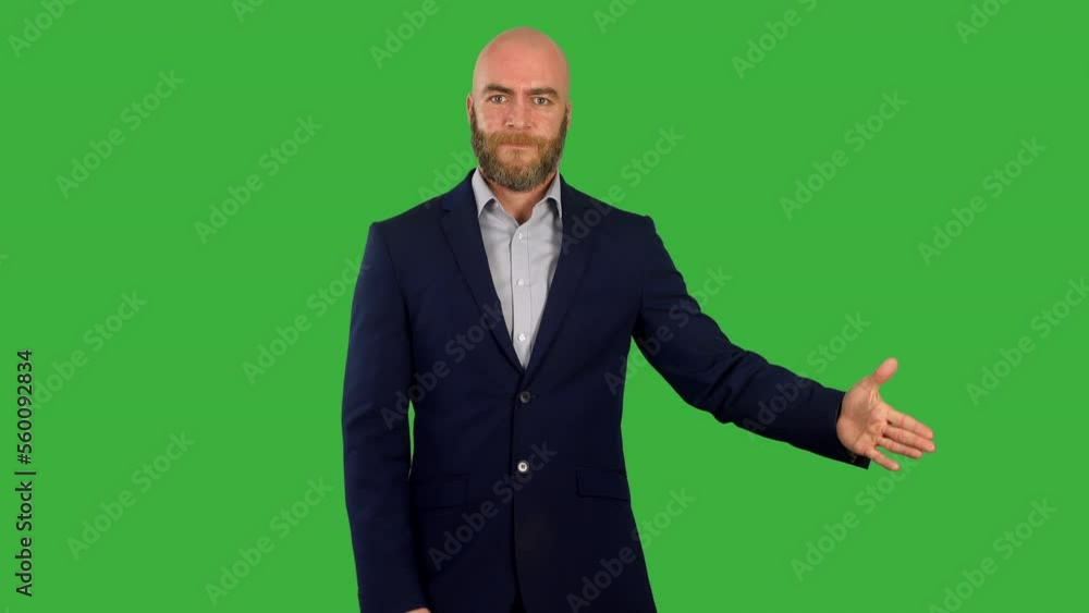 A man revealing something on screen as he is presenting on green screen A man revealing something on screen as he is presenting on green screen