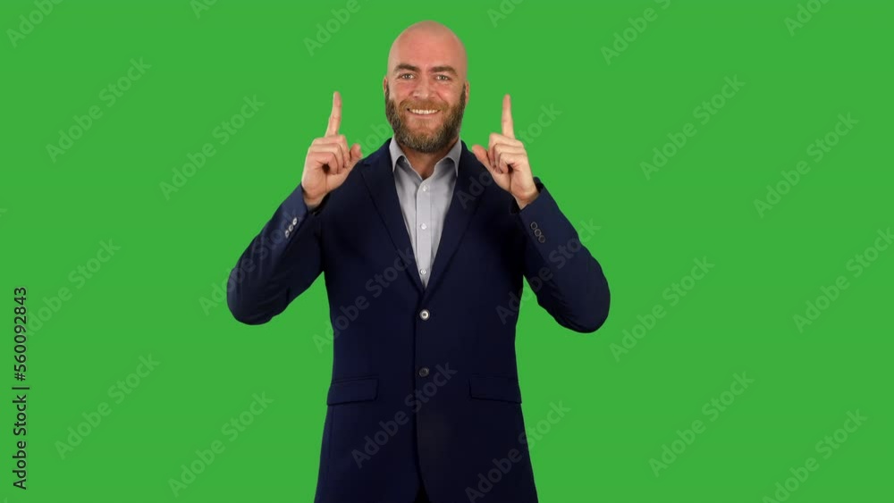 Pointing up on green screen. A businessman with a beard gesturing with fingers Pointing up on green screen. A businessman with a beard gesturing with fingers