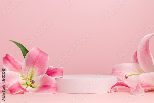 Podium with lily flowers close up on pink background. Showcase for wedding, valentine, cosmetic, perfume and product presentation