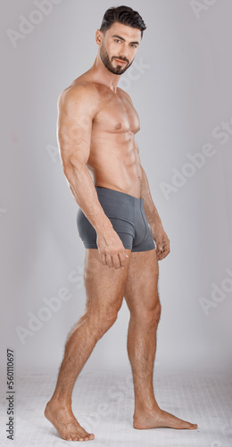 Portrait, body and a man underwear model in studio on a gray background to promote a brand of drawers. Health, fitness and wellness with a handsome young male posing in underpants for comfort