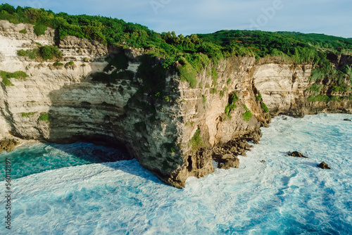 Drone view of rocky cape with ocean near Uluwatu temple in tropical Bali