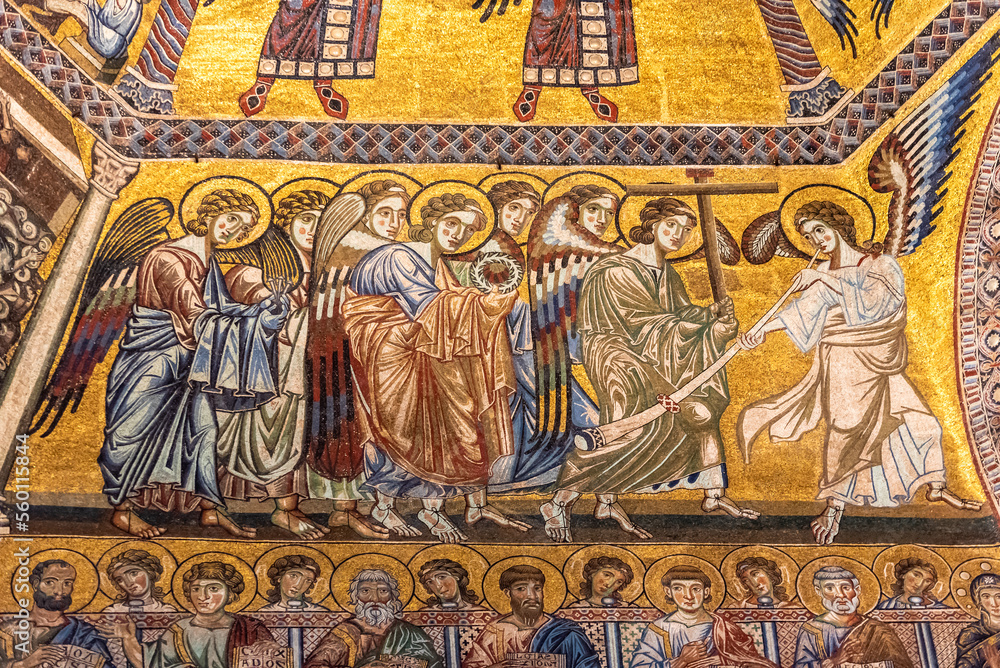 Close-up on golden religious mosaic decorating catholic church in Florence showing angels and saints
