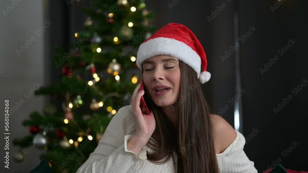 Closeup of woman at christmas talking on mobile phone. Closeup of woman at christmas talking on mobile phone.