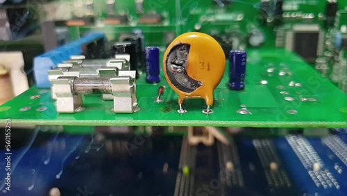The explosion of the varistor on the electronic board. photo