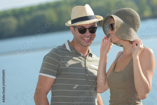 portrait of couple wearing sunhats in sumemr weather photo