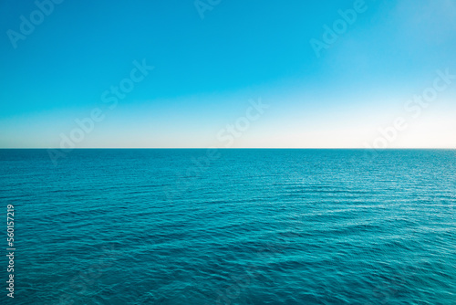 Summer seascape. Cruise on the ship. Blue sea, sky and horizon line.
