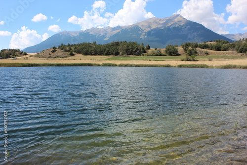 Alpine landscape in the Hautes-Alpes with on the mountains, lake and sky.