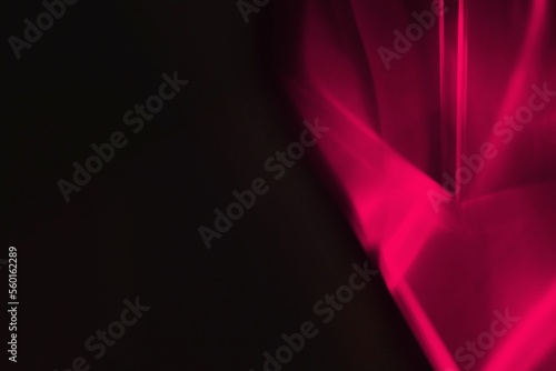 Abstract soft satin background in trendy color Viva Magenta. Color of the year 2023.