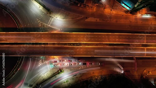 Traffic an important infrastructure, financial technology, Expressway top view, traffic transportation above intersection road in city night sky aerial view cityscape of advanced innovation,Hyperlapse