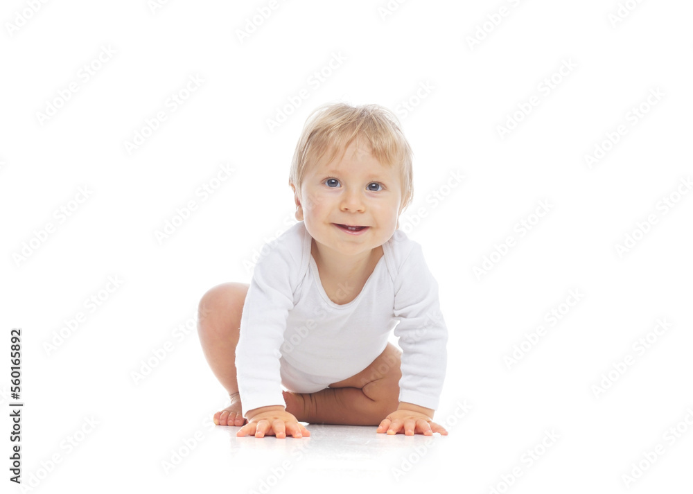Little, happy and smiling cute baby in the studio. Portrait of a one year old baby. The concept of happiness. Little, happy and smiling cute baby in the studio. Portrait of a one year old baby. The concept of happiness.