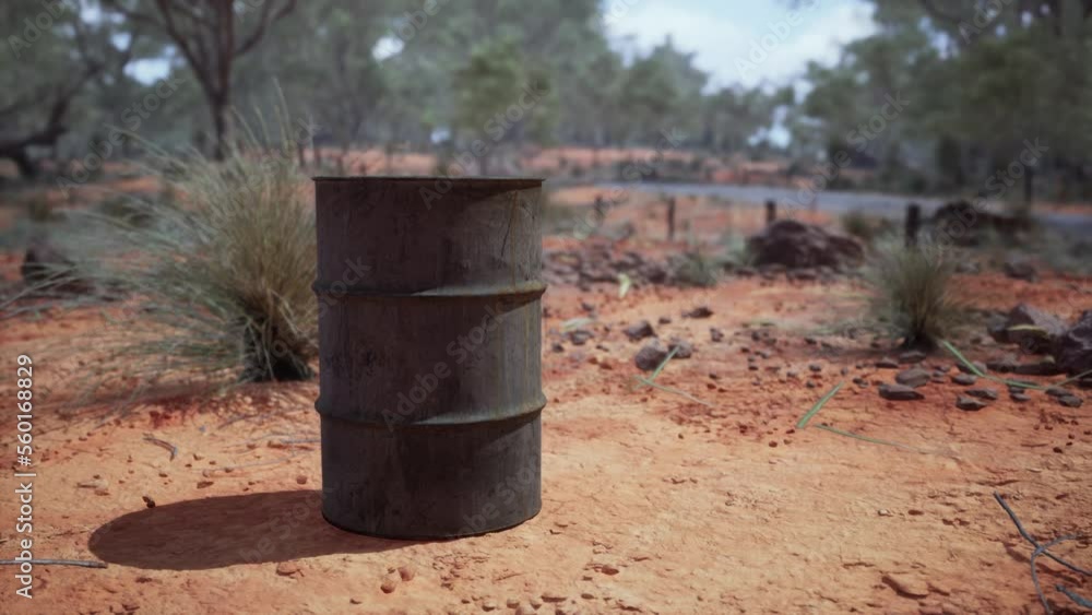 old empty rusted barrel on sand old empty rusted barrel on sand