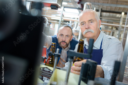 portrait of two factory engineers in drinks production plant