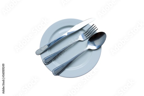 , spoon, and kForknife silverware in empty white plate isolated on white background closeup.