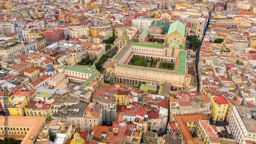 Aerial view of the Basilica of Santa Chiara, a religious complex in Naples, Italy. The building includes a church, a monastery, tombs, an archaeological museum and a cloister with internal gardens.