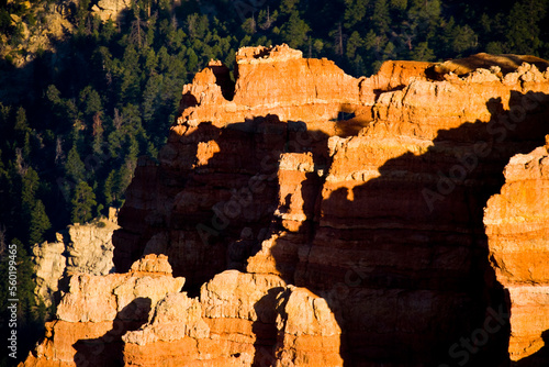 Sunrise colors and dark shadows of the Claron Formation of sandstone cliffs in Southern Utah.