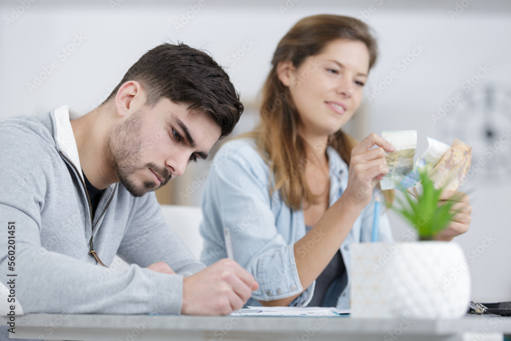happy couple with papers and calculator at home happy couple with papers and calculator at home