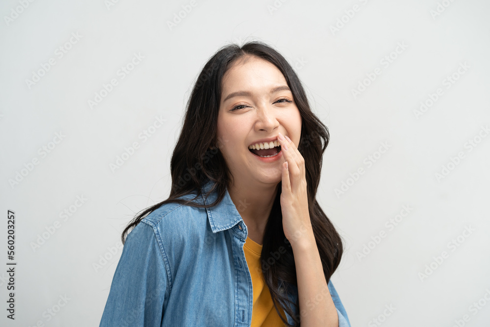 Beautiful young lady in happiness moment, woman smiling and laughing isolated on background Beautiful young lady in happiness moment, woman smiling and laughing isolated on background
