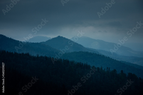 Fototapeta Naklejka Na Ścianę i Meble -  Breathtaking views over the valley of impressive Tatra mountains in misty weather. National park in Zakopane, Poland.