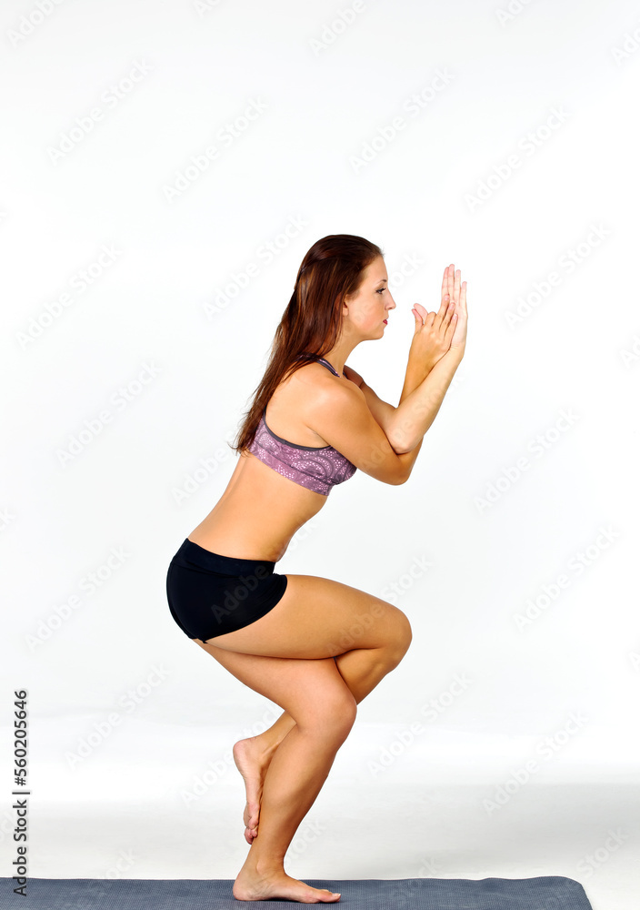 Brunette Yoga Fitness Model Exercises In A Studio Environment Brunette Yoga Fitness Model Exercises In A Studio Environment