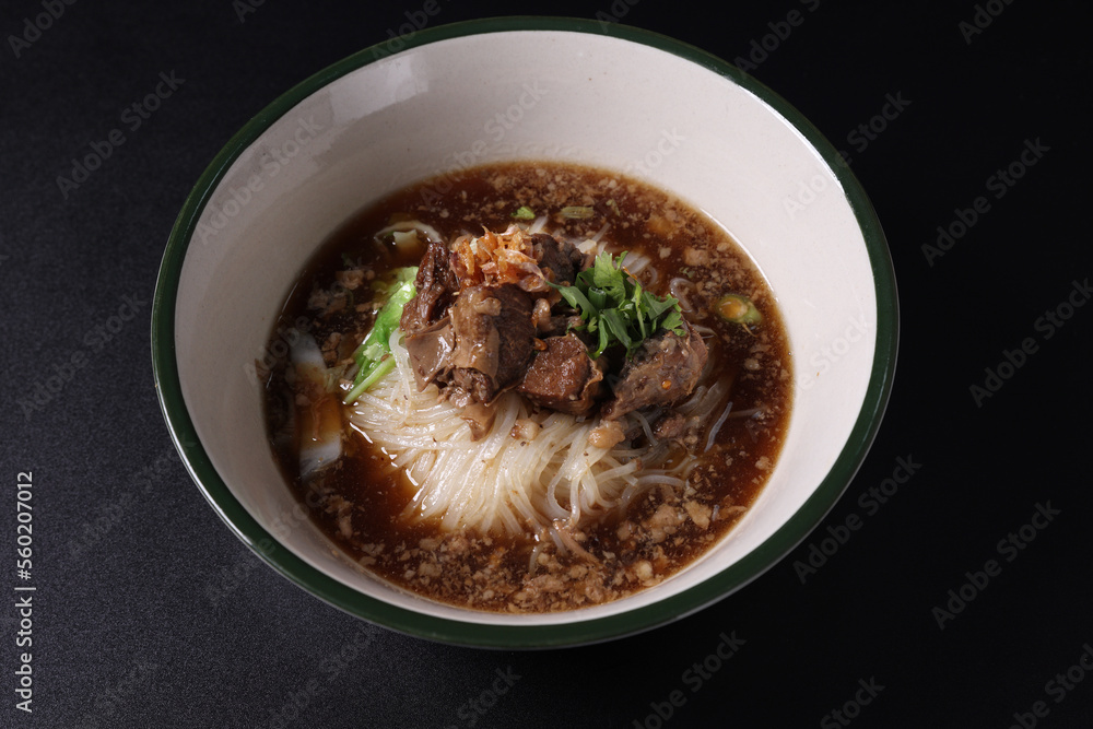 Braised pork noodles Thai street food isolated in black background Braised pork noodles Thai street food isolated in black background
