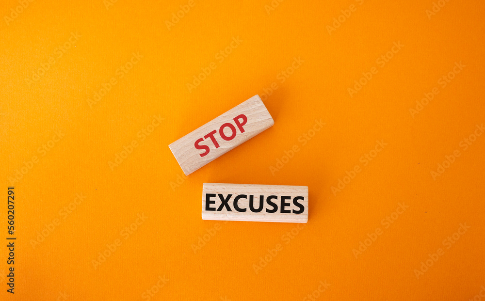 Stop excuses symbol. Concept words Stop excuses on wooden blocks. Beautiful orange background. Business and Stop excuses concept. Copy space. Stop excuses symbol. Concept words Stop excuses on wooden blocks. Beautiful orange background. Business and Stop excuses concept. Copy space.