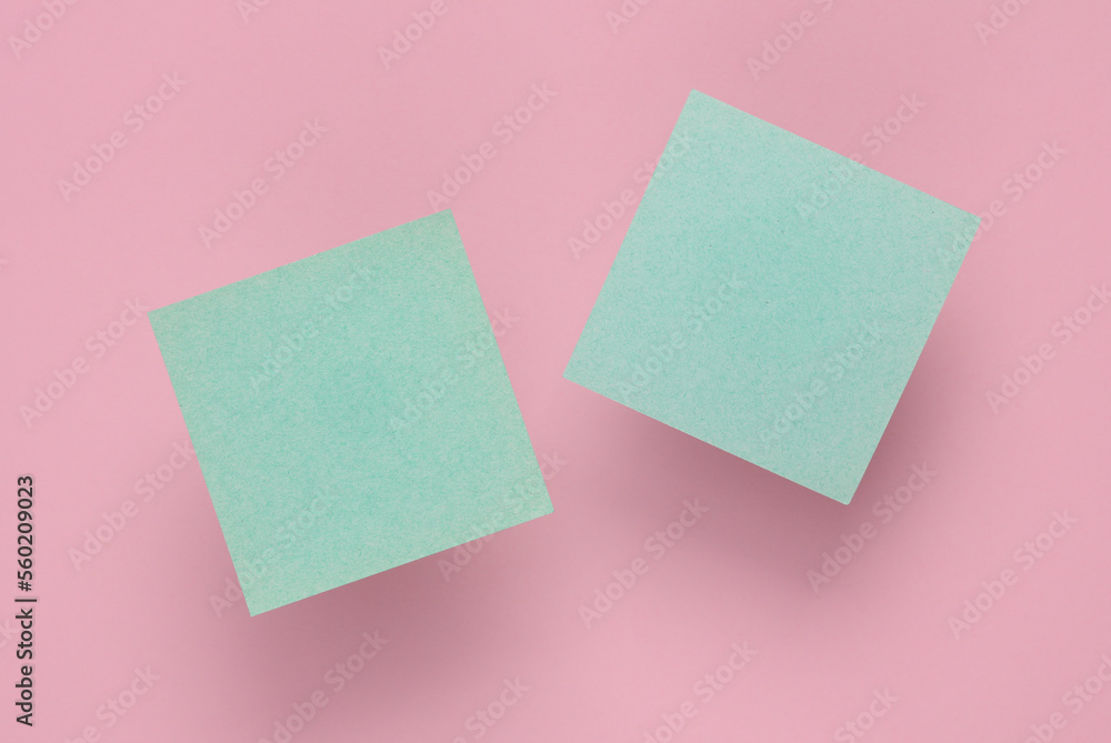 Empty Memo square sheets of paper on pink background Empty Memo square sheets of paper on pink background