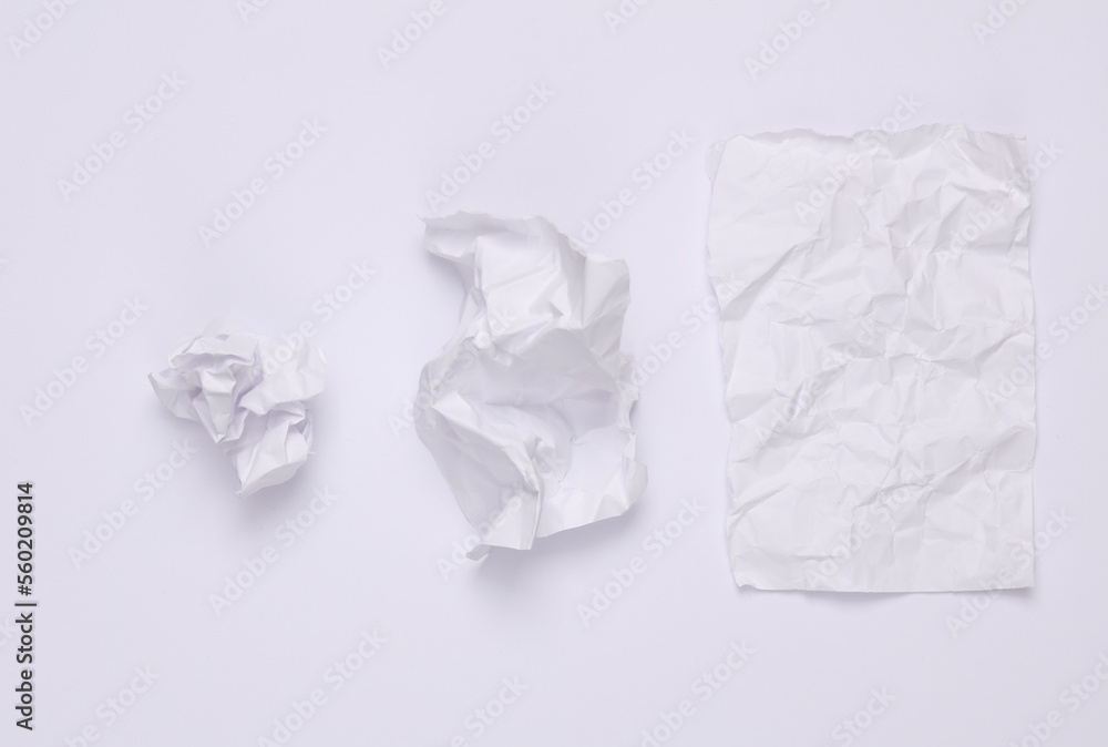 Step by step process of crumpling paper into a ball on a white background Step by step process of crumpling paper into a ball on a white background