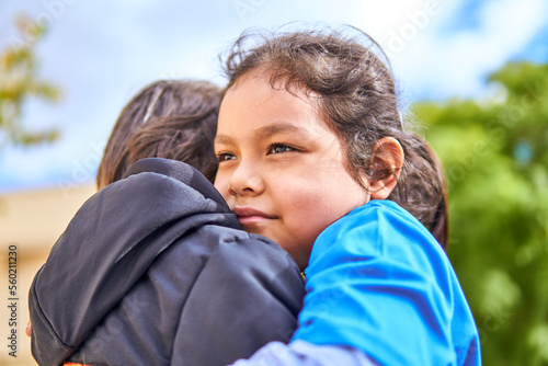 latin girl hugging boy with love and hope