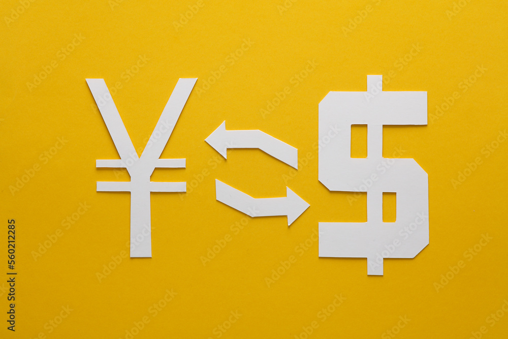 Fototapeta premium Currency exchange. Paper cut yuan and dollar symbol with exchange arrows on yellow background