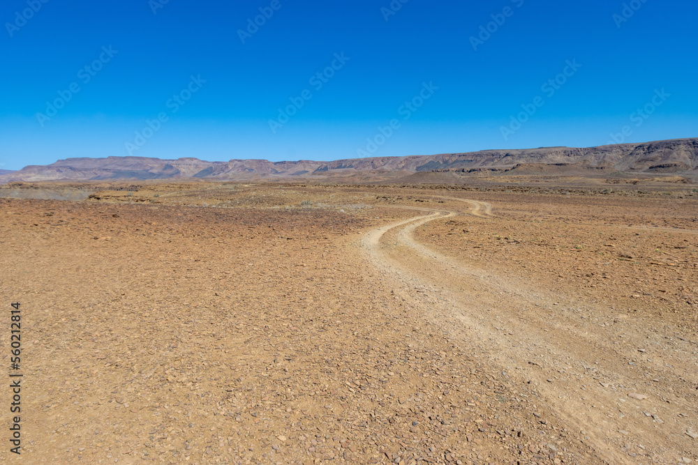 car track in the half desert of the fish river canyon car track in the half desert of the fish river canyon
