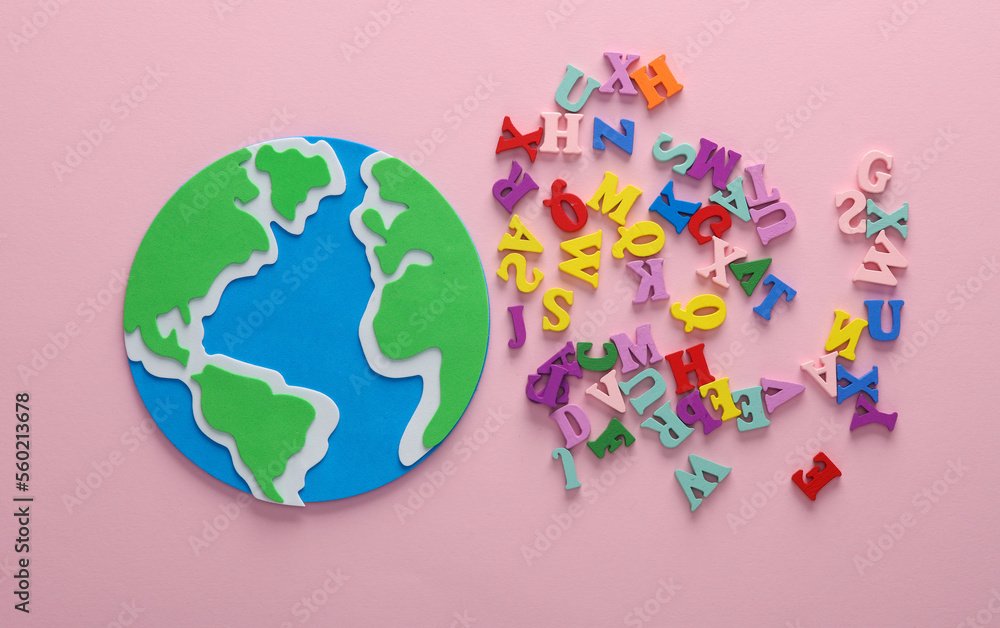 Globe and letters on pink background. Back to school. Education concept. Flat lay