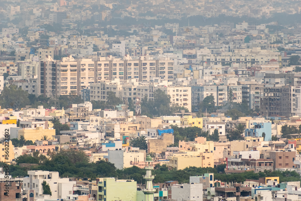 Aerial view of the densely packed concrete buildings in the urban cityscape of Hyderabad.