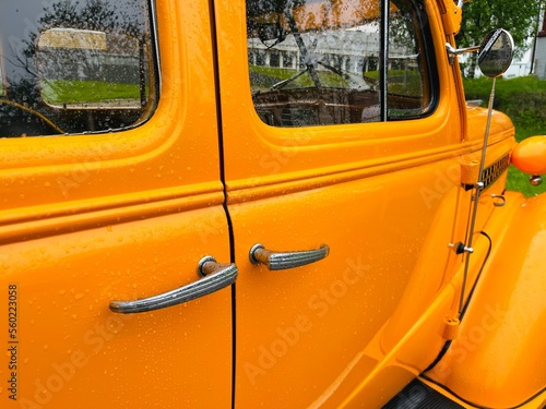 Orange vintage car on the street