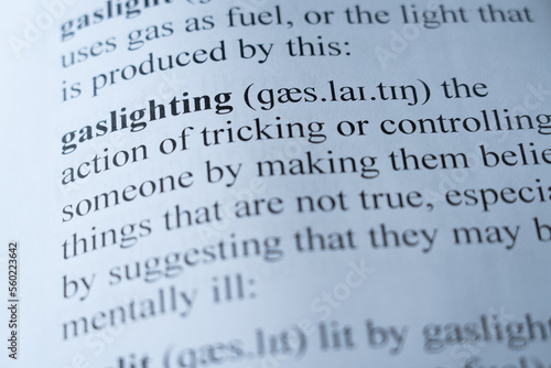 A mock up of a dictionary page with the word gaslighting with selective focussing photo