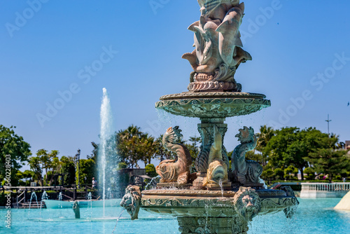 Fountain perspective in the park, sunny spring view from 