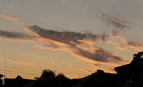 Panorama. Majestic Storm Clouds.  Landscape at sunset. The village in the steppe in the spring.