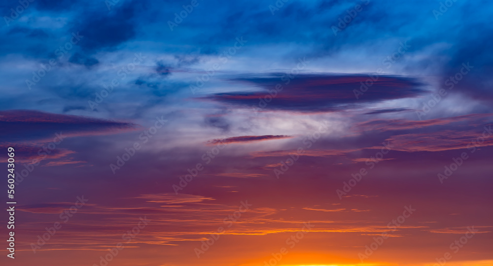 Sunset sky with multicolor clouds. Gorgeous panorama twilight sky and cloud at morning background. Dramatic beautiful sunset sunrise and dramatic clouds. Panorama sunset sky for background or sunrise