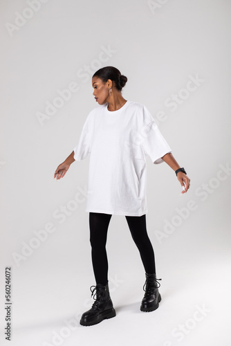 African american woman in oversized white t-shirt. Mock-up. photo