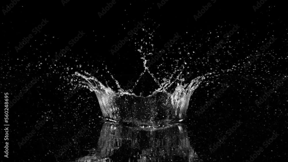 Super slow motion of splashing water crown shape on black background. Filmed on high speed cinema camera, 1000fps. Super slow motion of splashing water crown shape on black background. Filmed on high speed cinema camera, 1000fps.