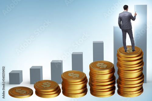 Businessman in the growth concept with coins chart