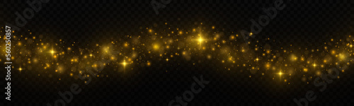 Golden luminous dust with colorful lights bokeh. Christmas trail concept. Abstract glowing lights isolated on transparent background.