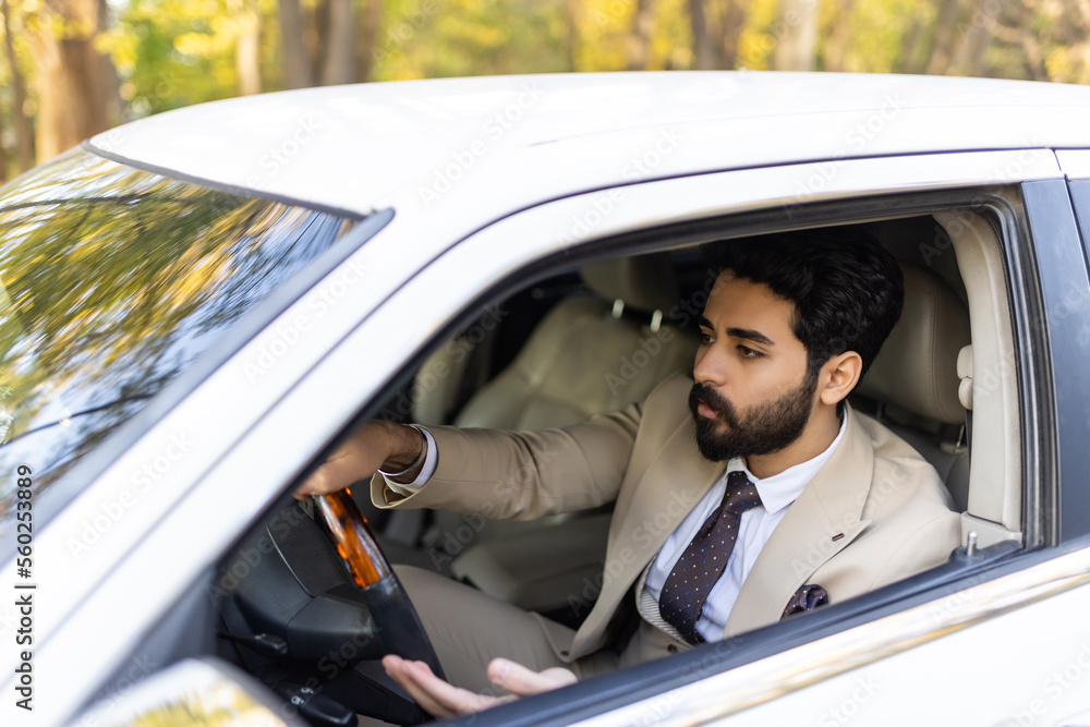 Arabic young business man drive luxury car