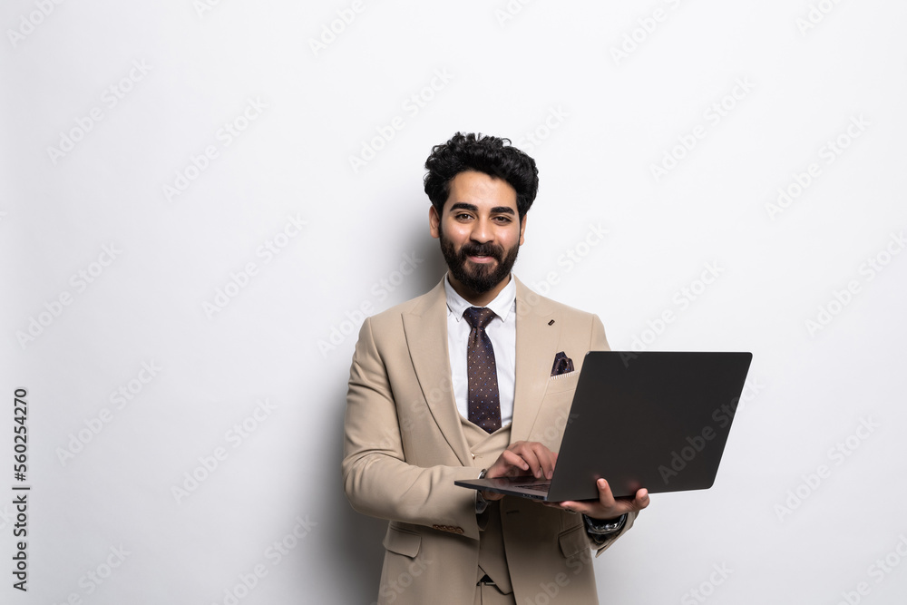 Portrait of handsome arab businessman with laptop on white background Portrait of handsome arab businessman with laptop on white background