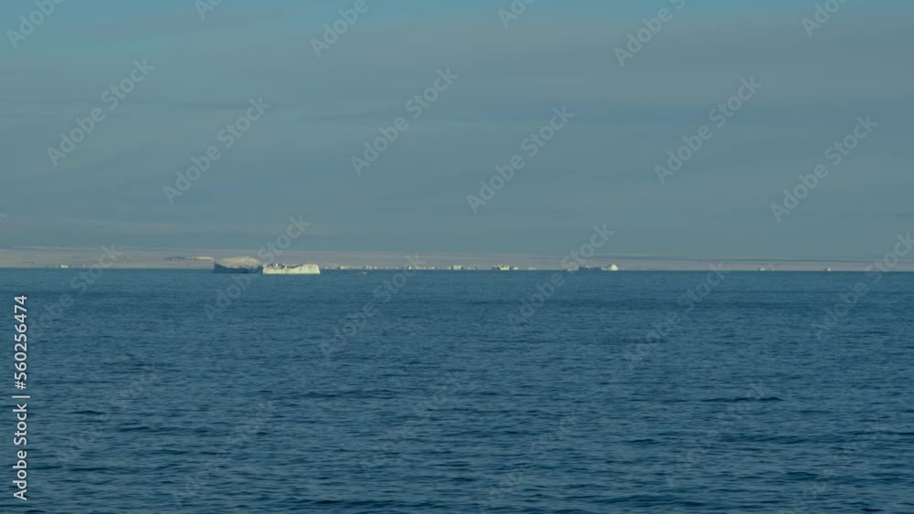 Icebergs on horizon. General plan. A lot of icebergs on background. Icebergs on horizon. General plan. A lot of icebergs on background.