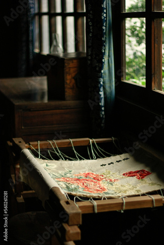 embroidery table in front of the window